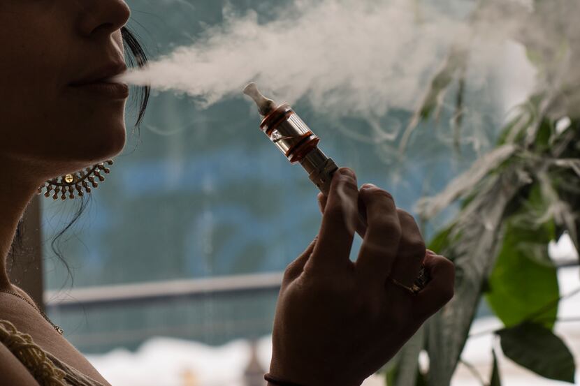 Ilona Orshansky, owner of Brooklyn Vape, uses a vaporizer, also known as an e-cigarette, in...