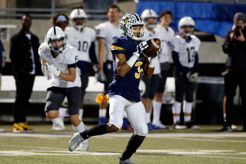Prestonwood's Ricky Baker (3) catches a pass and scores a touchdown against Fort Worth...