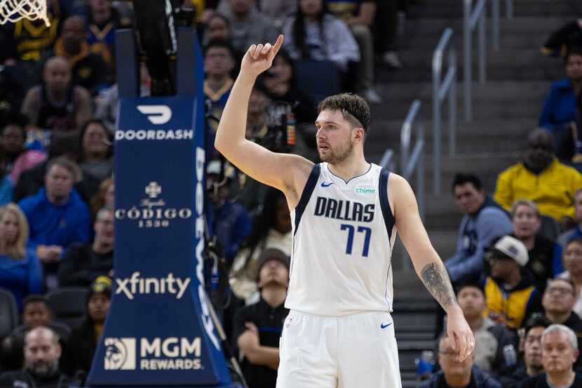Dallas Mavericks guard Luka Doncic (77) gestures after a foul was called against the Golden...