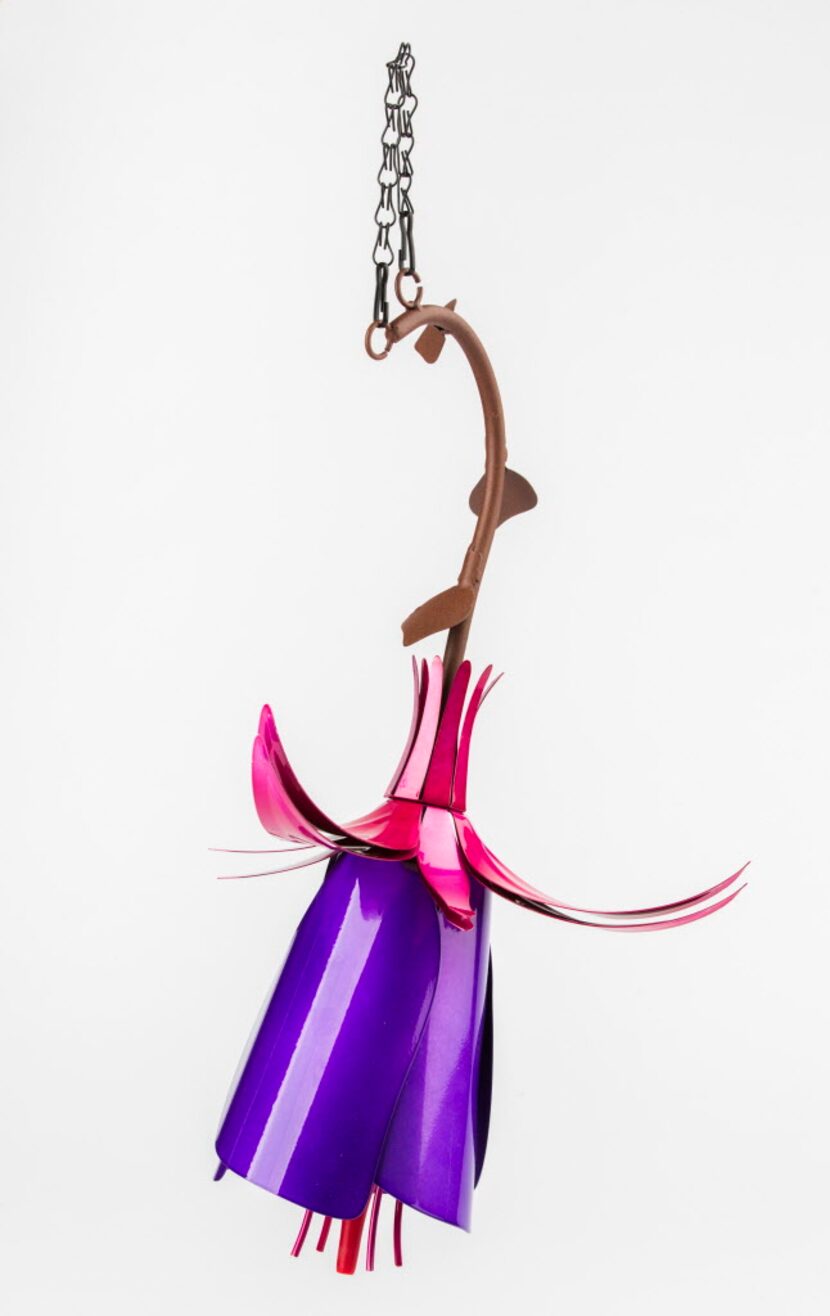 A steel-petaled fuchsia flower serves as garden ornament year-round and a hummingbird feeder...