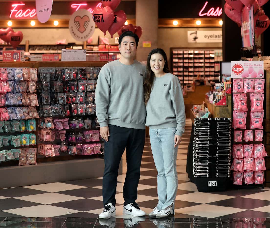 Jean and Kenneth Baik stand in front of their Miss A store in Frisco's Stronebriar Centre....