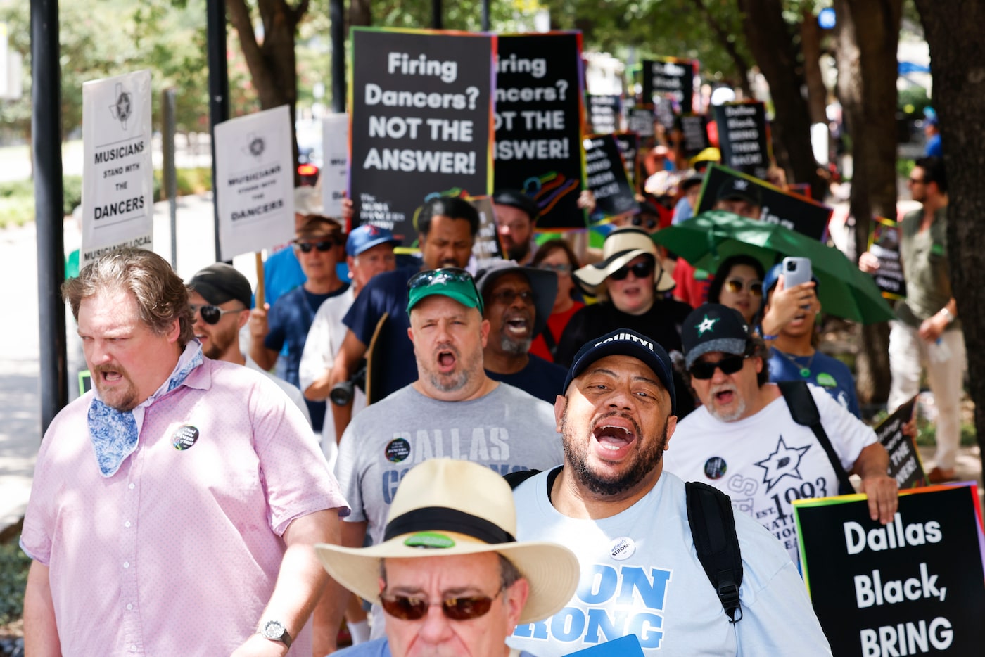 Union members, elected officials and allies from the community take part in a rally calling...