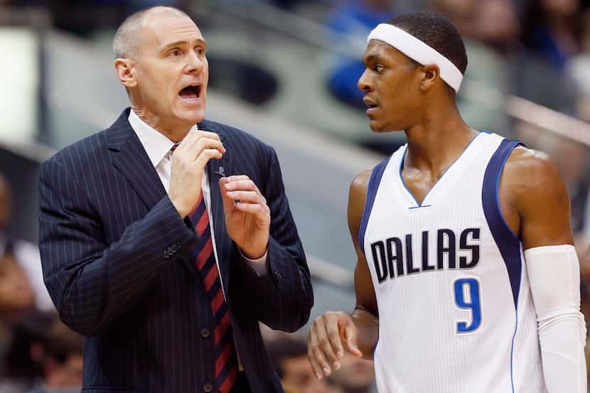 DALLAS, TX - DECEMBER 26:  Head coach Rick Carlisle of the Dallas Mavericks talks with Rajon...