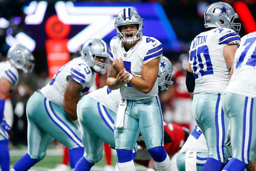 Dallas Cowboys quarterback Dak Prescott (4) changes the play at the line of scrimmage in the...