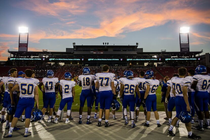 Frisco football players watch the first quarter of their game against Frisco Centennial from...