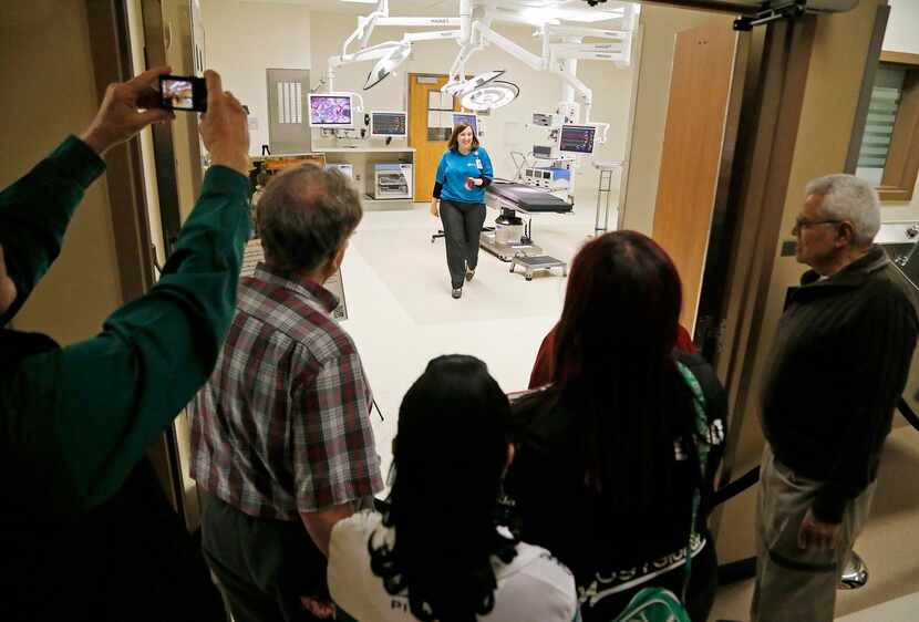 
Visitors snapped photos of an operating room at the new Parkland Memorial Hospital as...