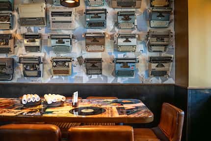 Postino in Addison has typewriters hanging on the wall and records sealed into the tabletops.
