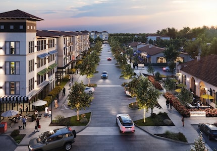 Four-story residences and restaurants line a street that would lead to a hotel within...