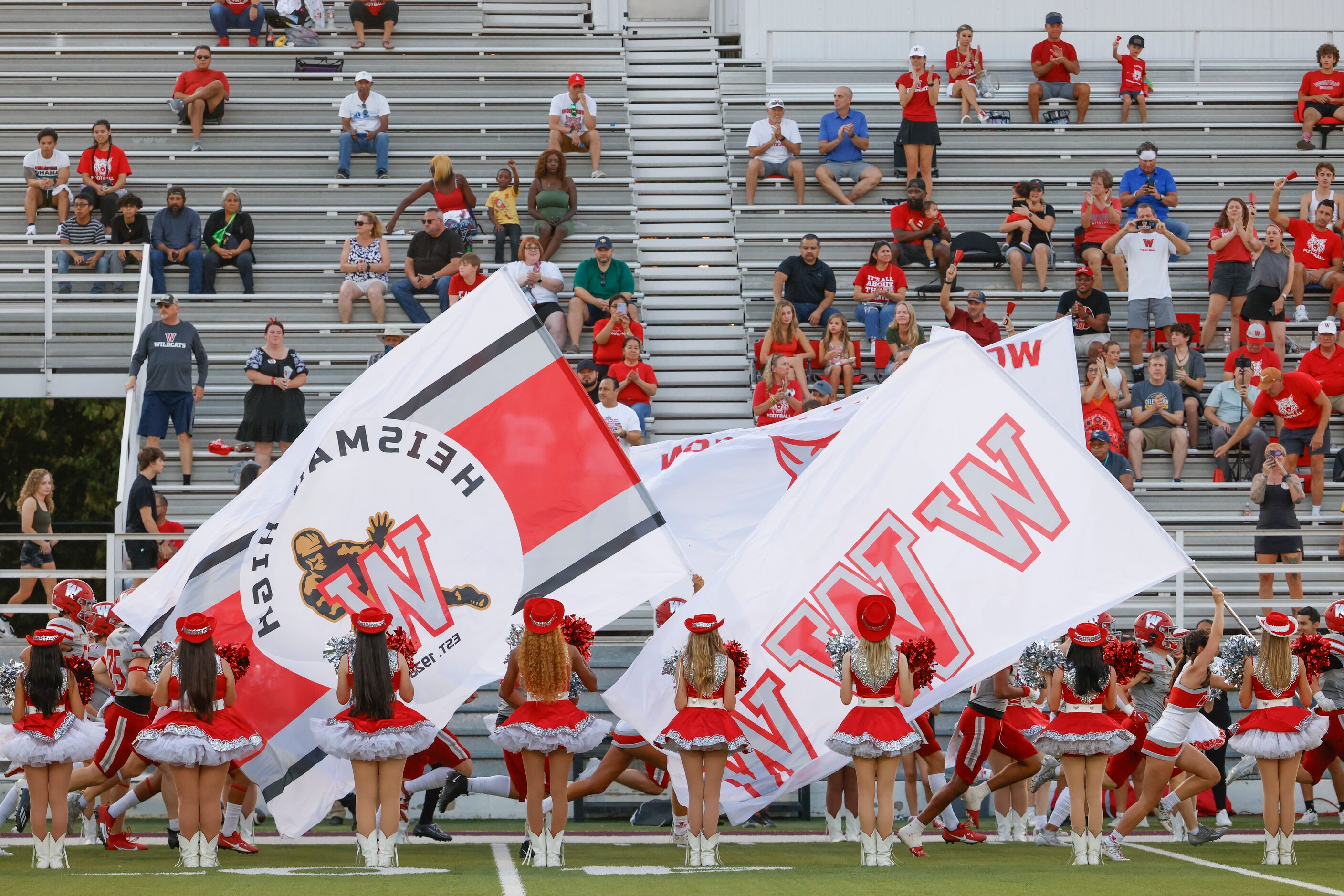 Woodrow Wilson players enters the field ahead of a football game against Emerson high on...