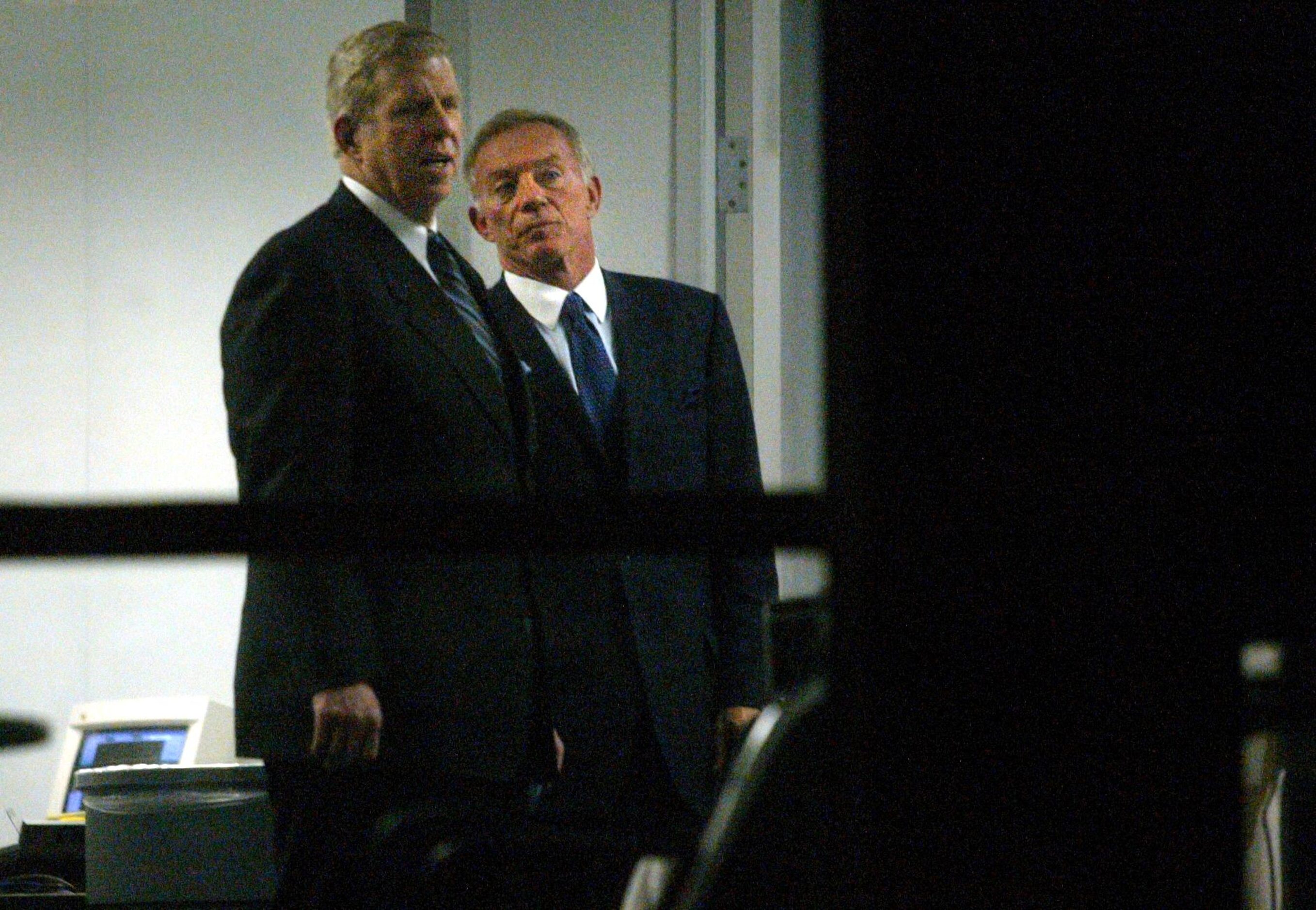 Cowboys owner Jerry Jones (right) and his new head coach Bill Parcells stop to look at a...