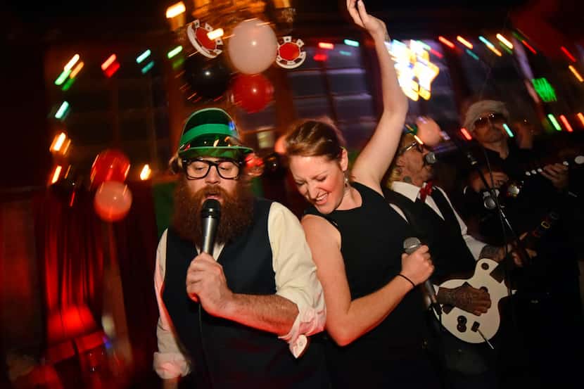 The hosts of Good Luck Karaoke at Twilite Lounge don costumes and erect sets in different...