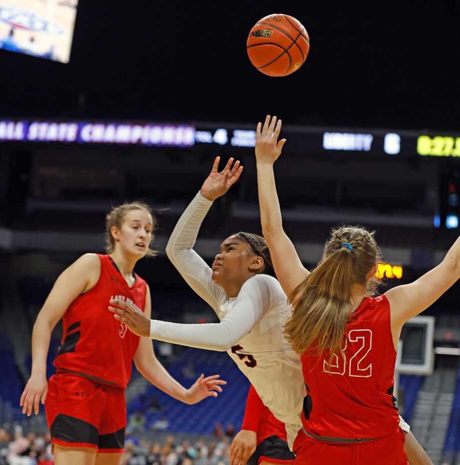 Frisco Liberty Keyera Roseby (5) is fouled by Lubbock Cooper Karlee Cronk (32) in girls...