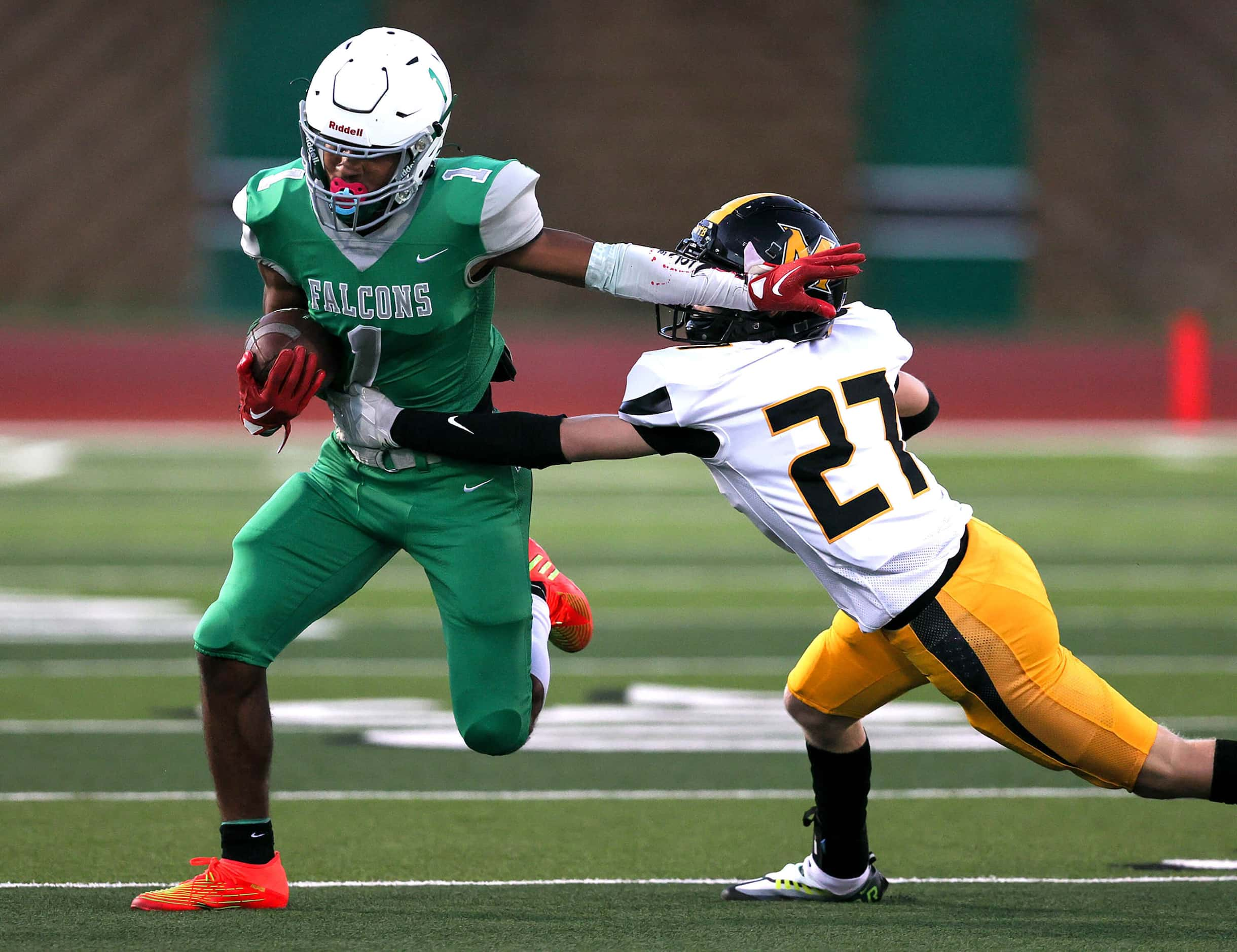 Lake Dallas wide receiver Niki Gray (1) tries to get around Frisco Memorial defensive back...