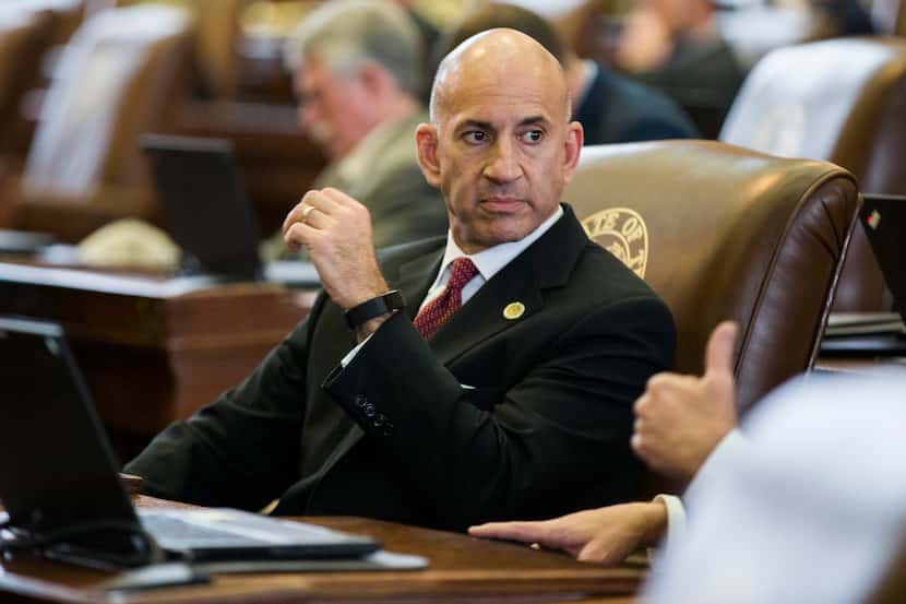 Representative Matt Shaheen sits at his desk on the third day of the 86th Texas legislature...