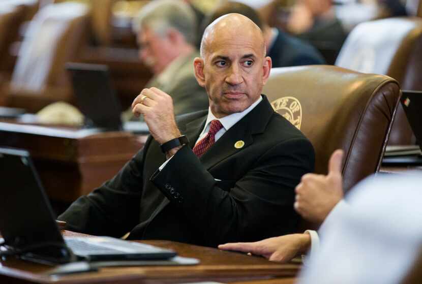 State Rep. Matt Shaheen sits at his desk on the third day of the 86th Texas Legislature on...