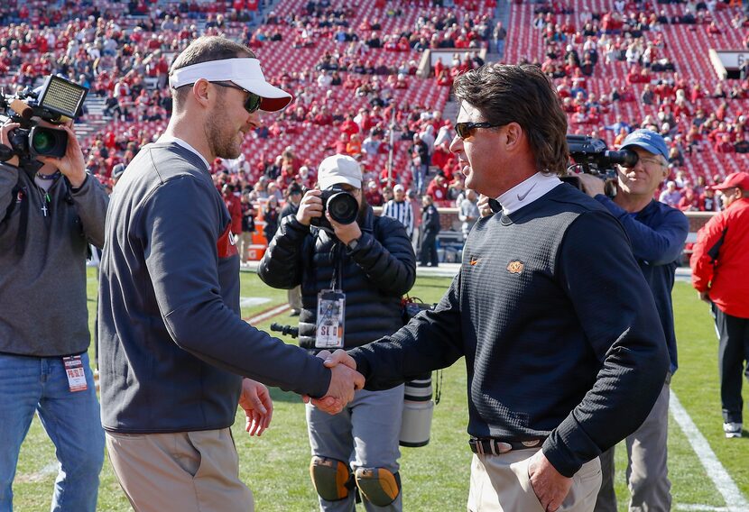 FILE - Oklahoma head coach Lincoln Riley, left, and Oklahoma State head coach Mike Gundy,...