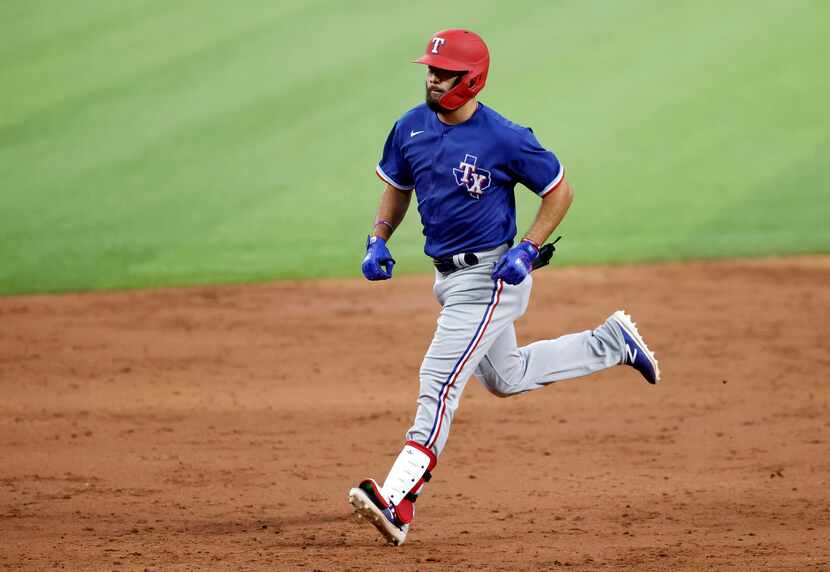 Texas Rangers Isiah Kiner-Falefa rounds the bases after his home run during a simulated...