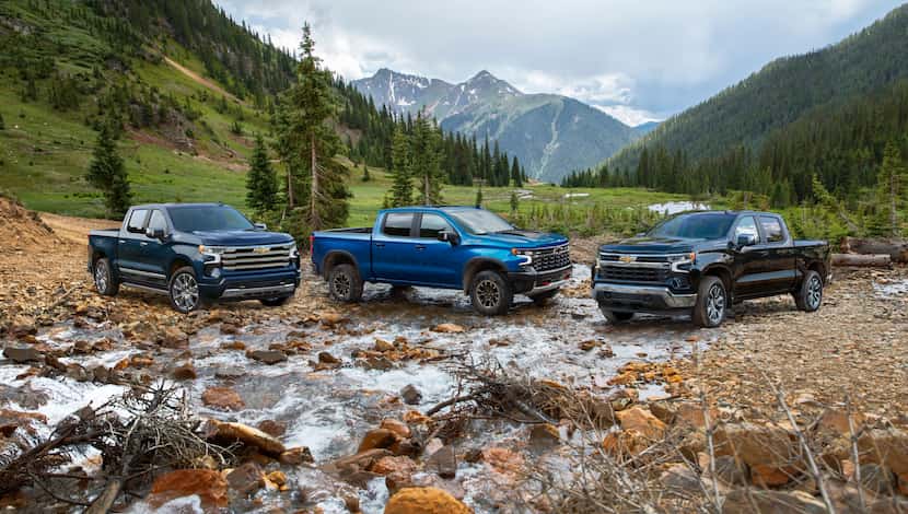 The 2022 Chevrolet Silverado High Country (left), ZR2 and LT models.