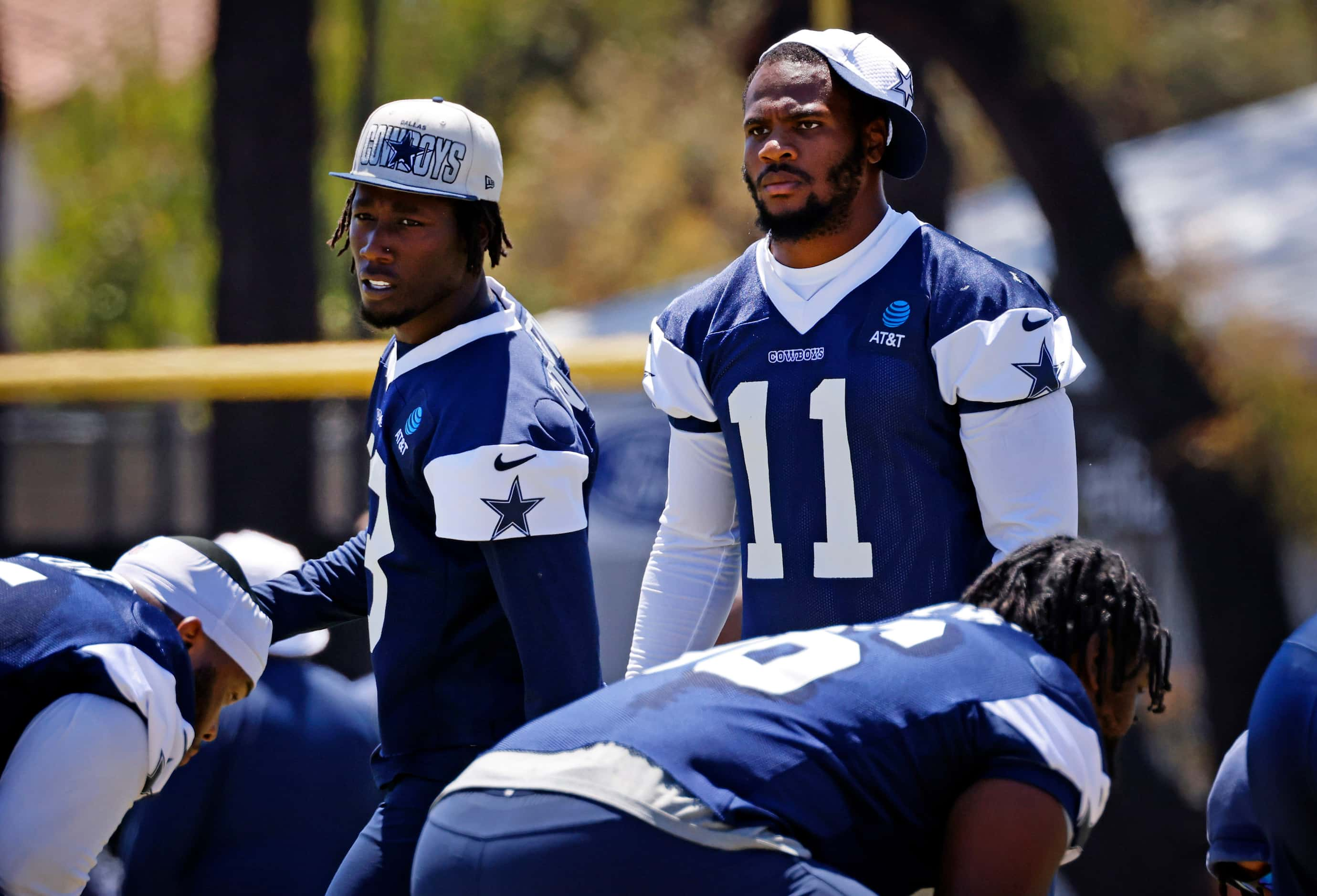 Dallas Cowboys linebackers Micah Parsons (11) and DeMarvion Overshown (13) line up for a...