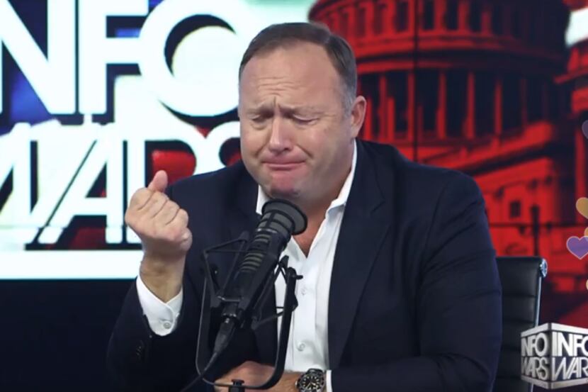 Alex Jones appears to cry while complaining about President Donald Trump's decision to...