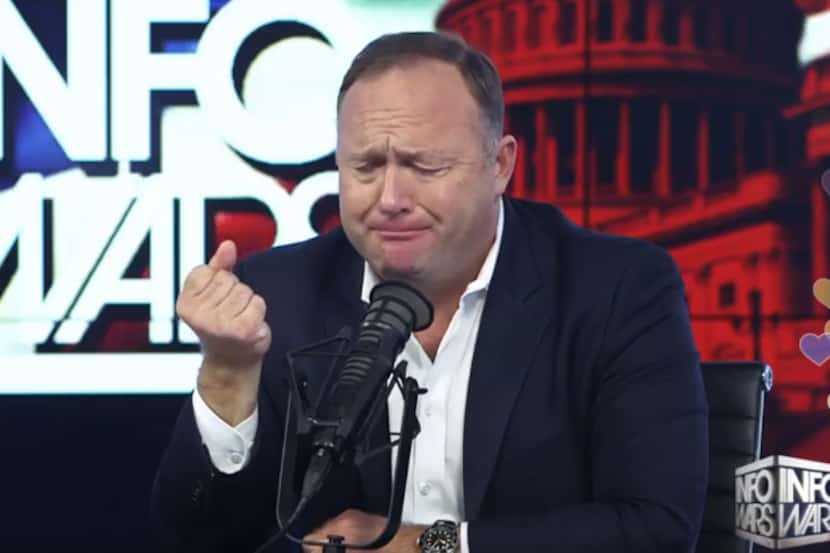 Alex Jones appears to cry while complaining about President Donald Trump's decision to...