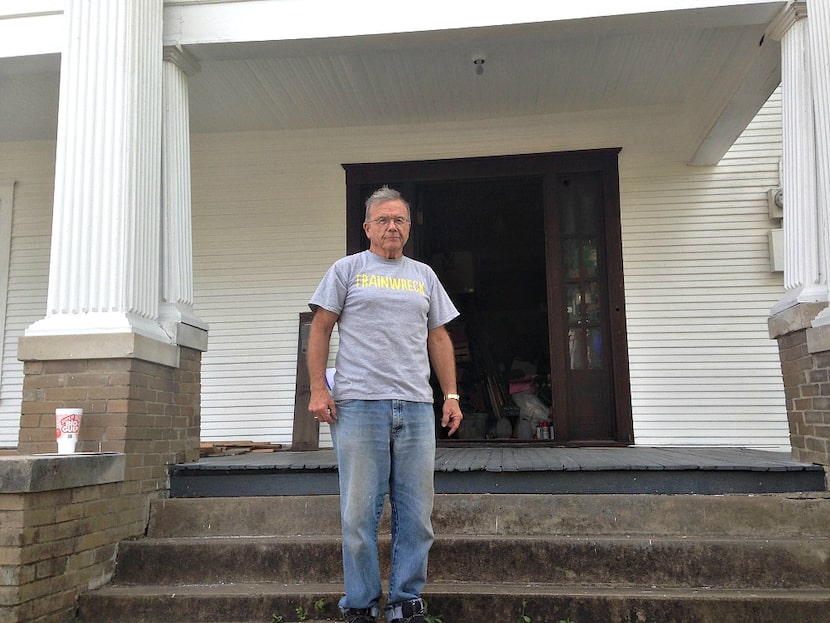 W.K. Jeffus outside his historic West Tenth Street home stuffed with newspapers, letters and...