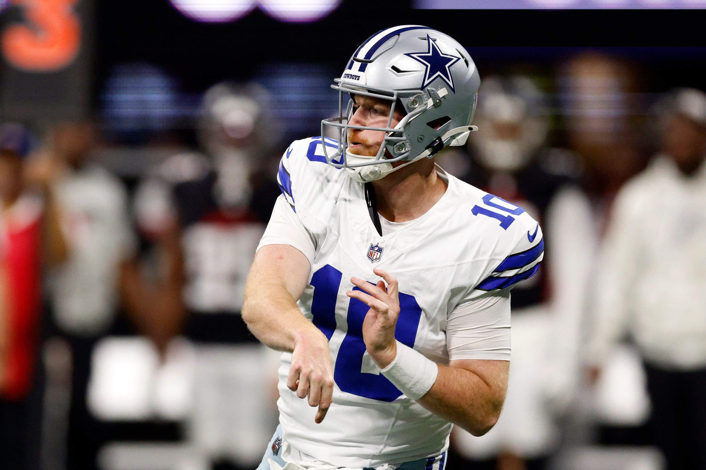 Dallas Cowboys quarterback Cooper Rush (10) throws a pass after entering the game for an...