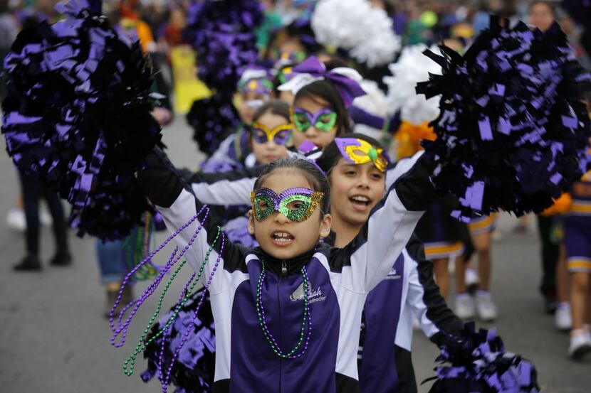 The Winnetka Elementary cheerleaders cheer during the Oak Cliff Mardi Gras Parade  in Dallas...