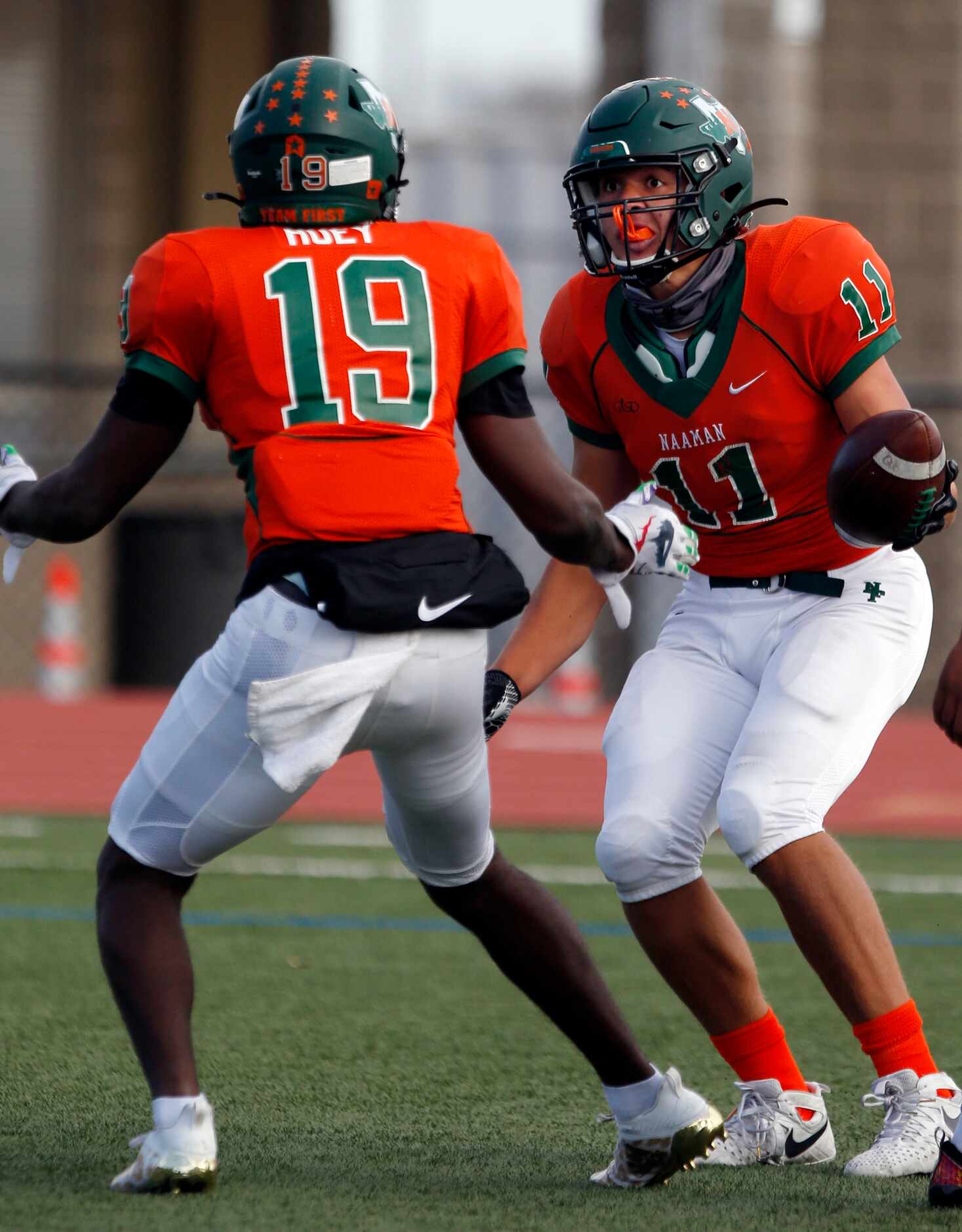 Naaman Forest’s Devean Deal (11) celebrates with teammate Brison  Huey (19), after catching...