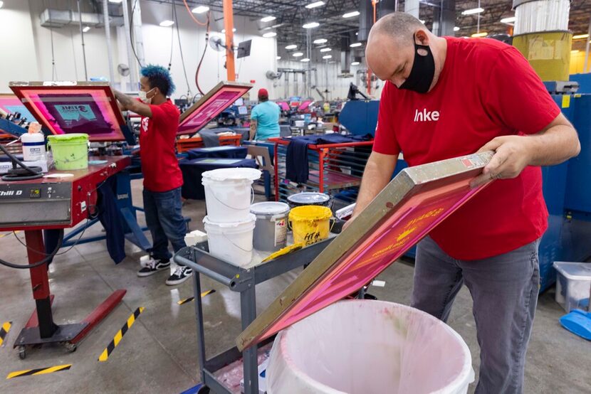 Workers are shown on the production floor at Custom Ink on Sept. 14 in Flower Mound.