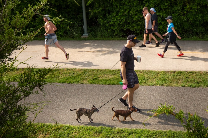 Dallasites run and walk at the Katy Trail in Dallas on Tuesday, April 21, 2020. 