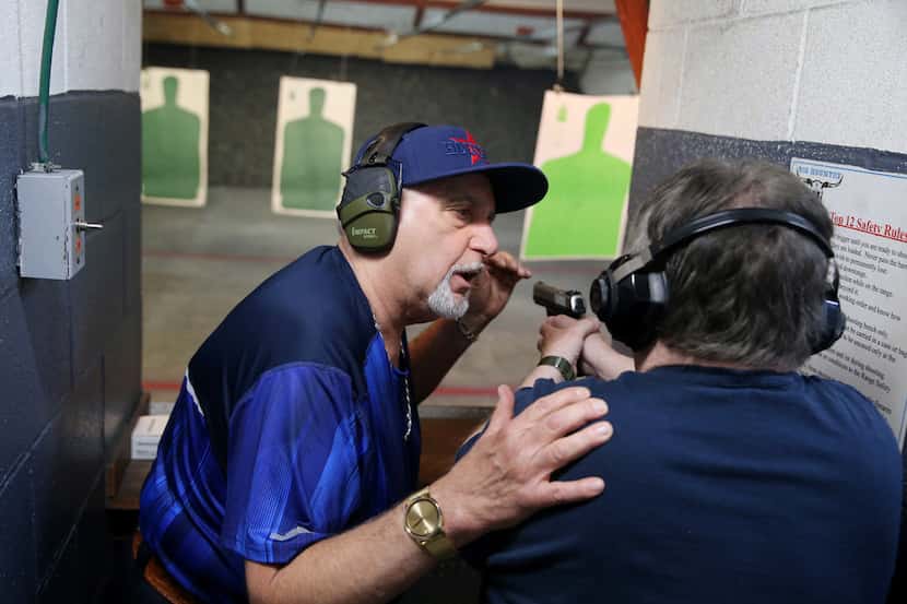 Instructor Mark Giordonello (left) talks to Robert Graham, of Friendswood, TX, during a...
