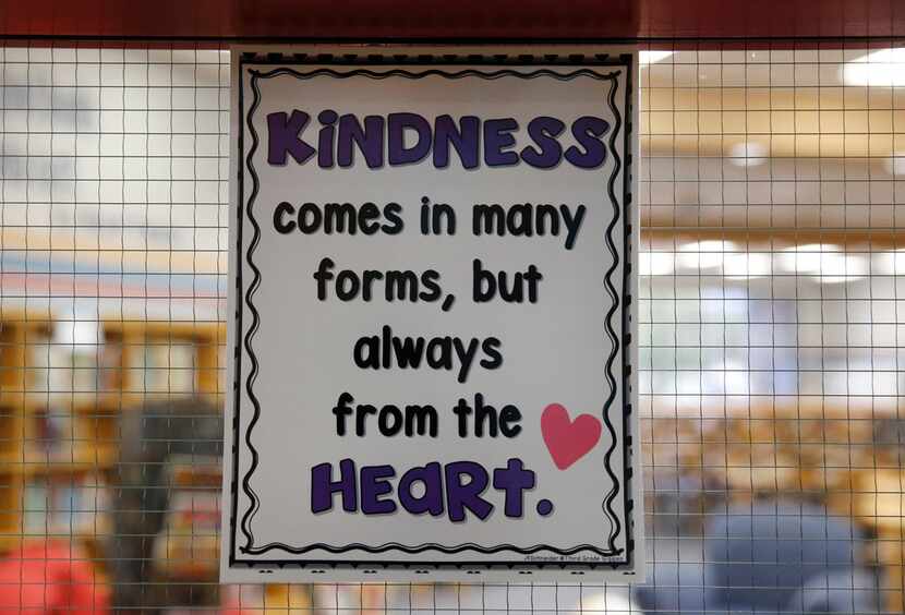 Signs giving examples of how to be kind at Scott Johnson Middle School in McKinney on...