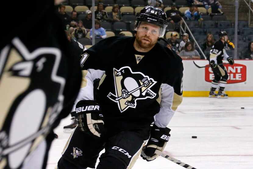Pittsburgh Penguins' Phil Kessel (81) warms up before an exhibition NHL hockey game against...