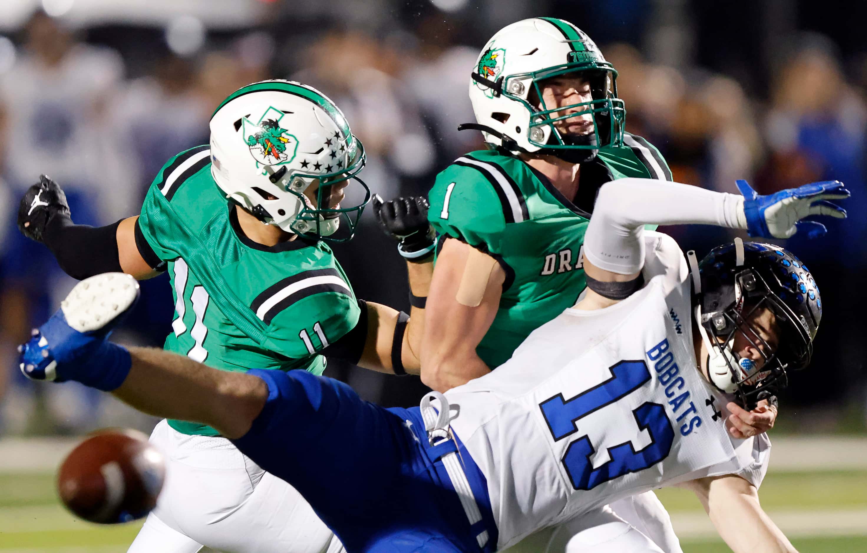 Southlake Carroll’s J David Sparks (11) and Logan Anderson (1) help breakup a pass in the...