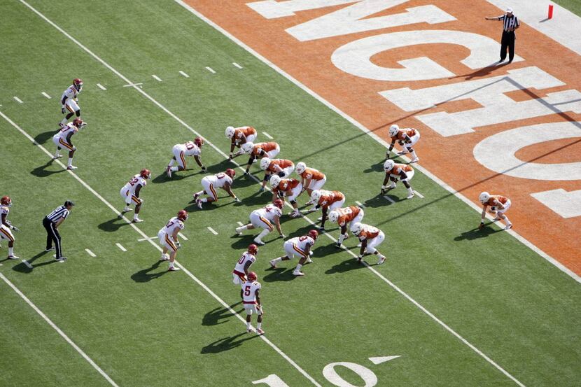 Nov 10, 2012; Austin, TX, USA; Texas Longhorns offense lines up in the wishbone formation in...