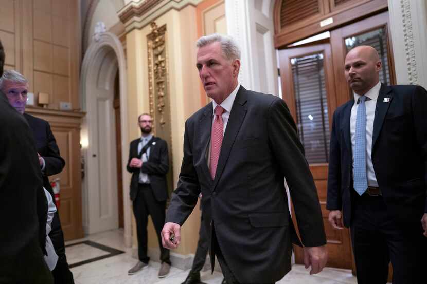 House Republican Leader Kevin McCarthy leaves a meeting room at the Capitol as he negotiates...