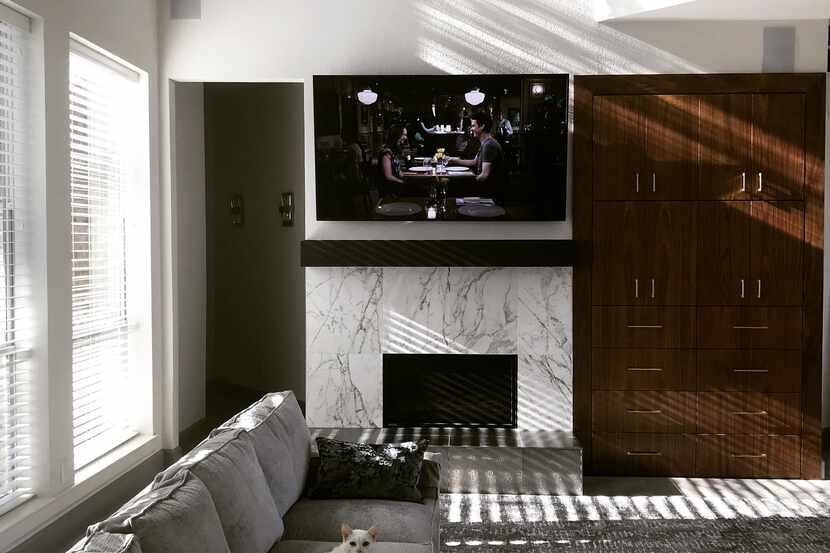 The large downstairs closet space was transformed into an eye-catching vertical media center...