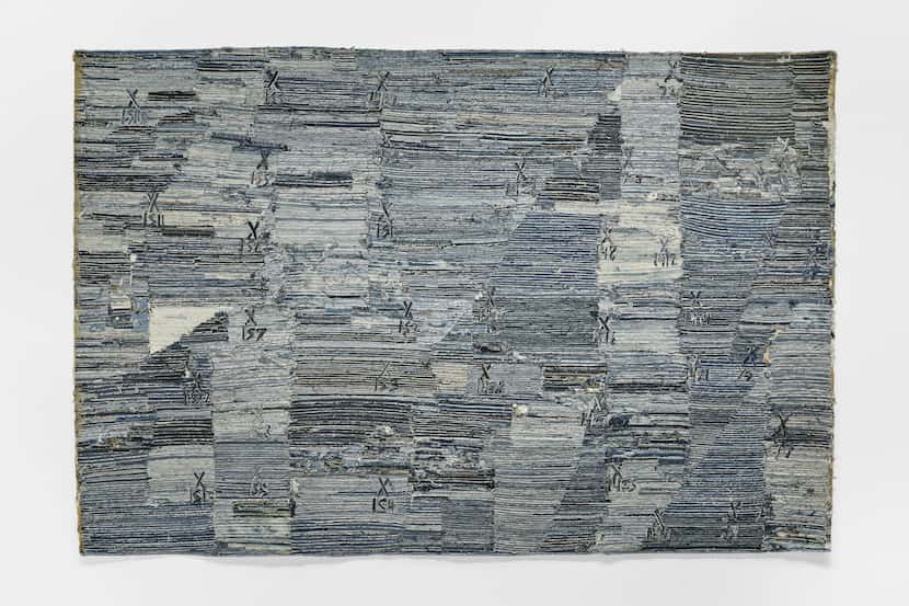 Jamal Cyrus' "River Bends to Gulf (Double Time)," a 2021 denim-and-cotton-thread work, is...