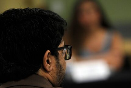 Najeeb Aminyar listens to a question from U.S. Senator John Cornyn during a roundtable...