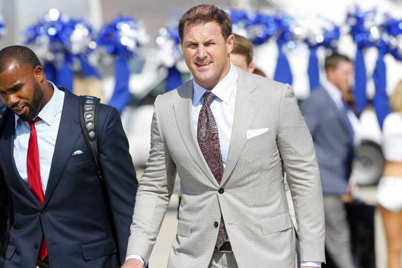 Dallas Cowboys tight end Jason Witten (right) arrives for training camp at Naval Air Station...