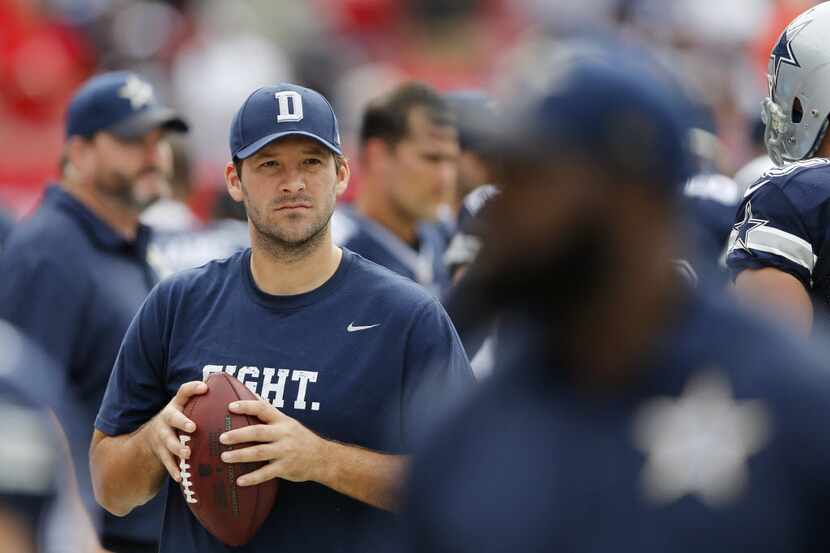 Dallas Cowboys quarterback Tony Romo (9) with the ball before the start of the game at...