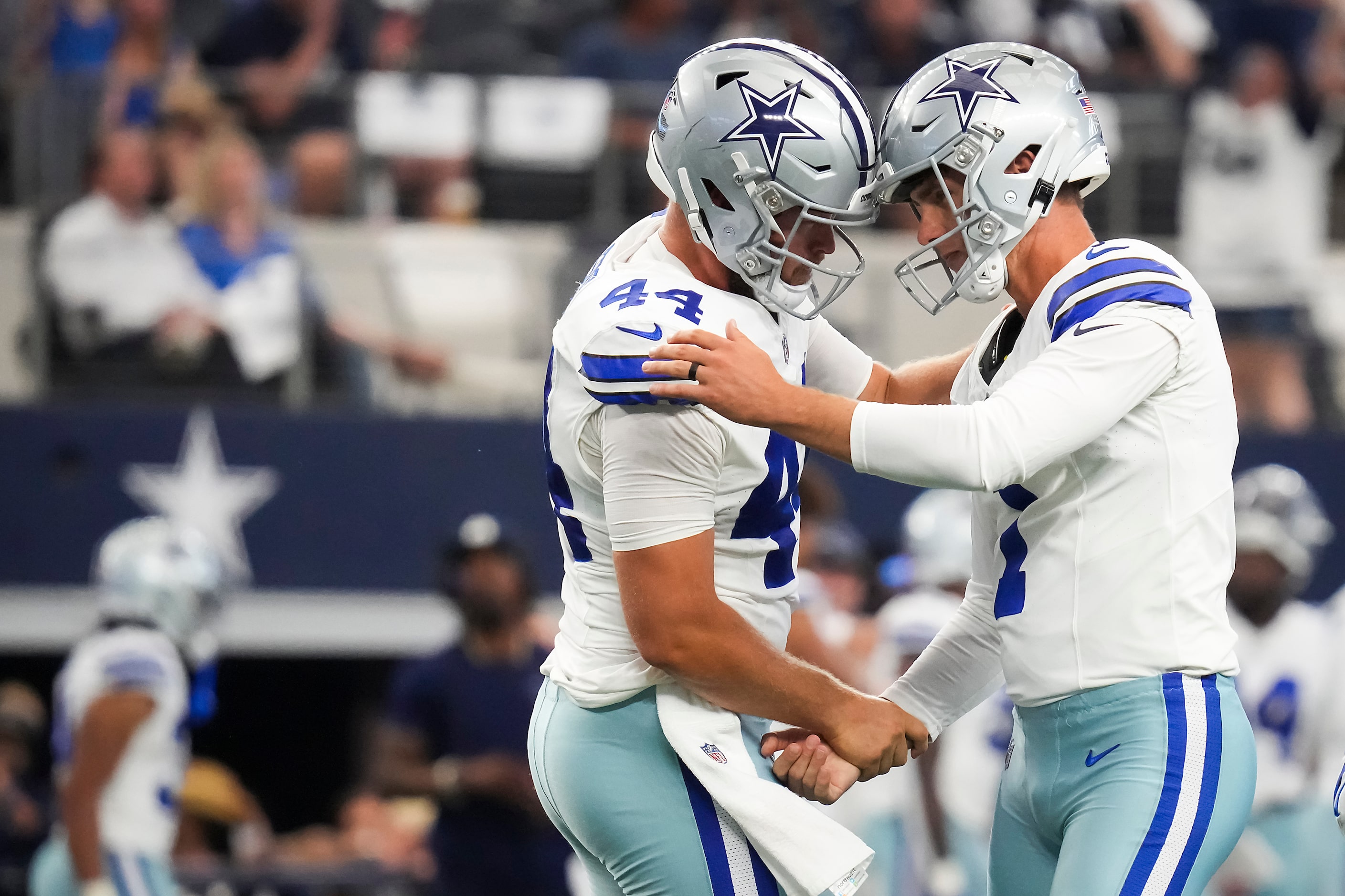 Dallas Cowboys kicker Brandon Aubrey (1) celebrates with long snapper Trent Sieg (44) after...