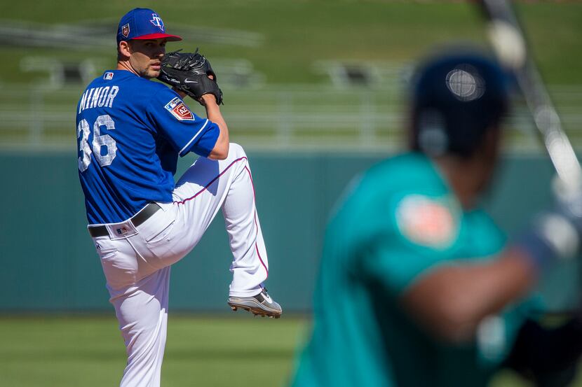 Texas Rangers pitcher Mike Minor pitches during the fourth inning of a spring training...