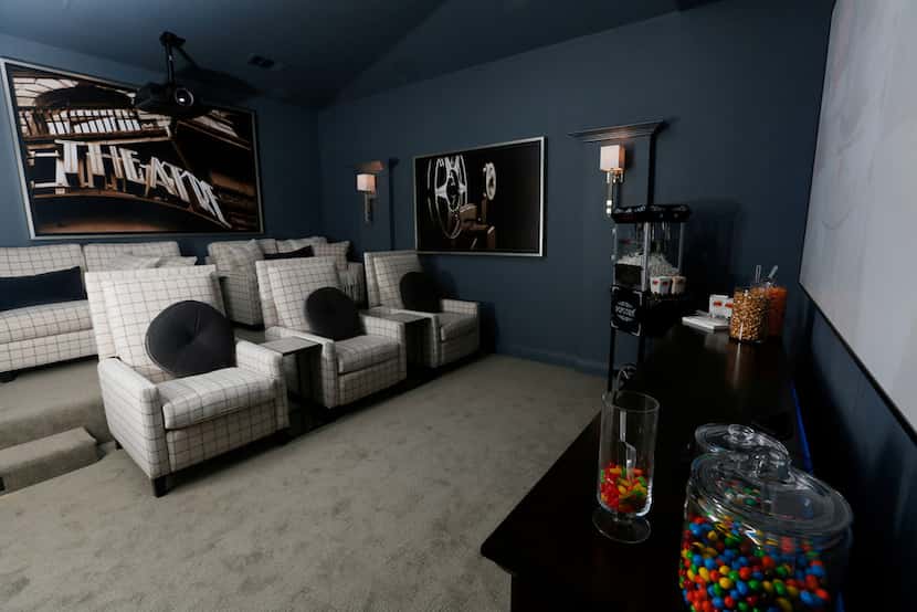 The theater room inside HGTV's Smart Home in Roanoke has three recliners and two loveseats.