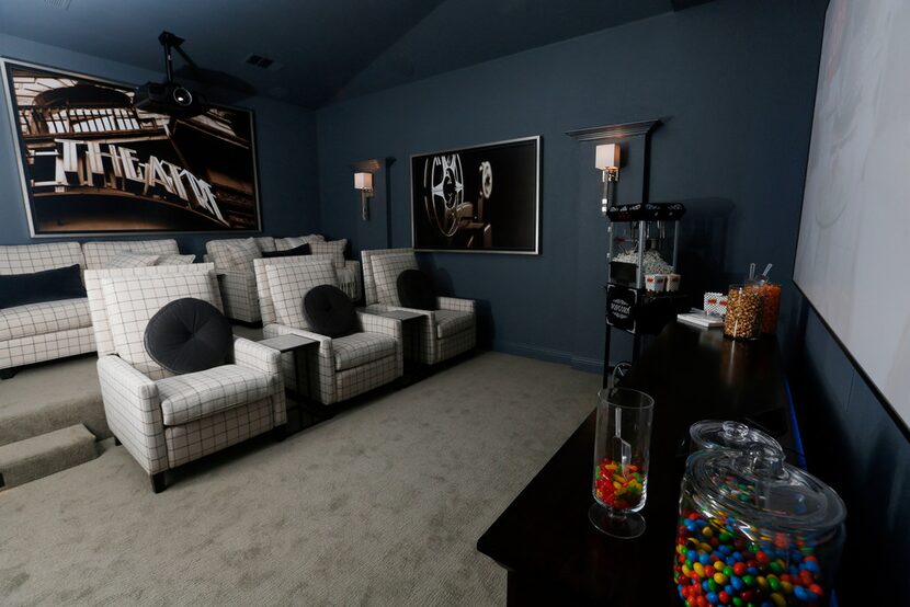 The theater room inside HGTV's Smart Home in Roanoke has three recliners and two loveseats.