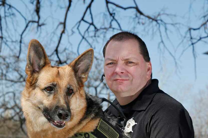 
Jim Osorio (with his German shepherd, Coral) operates Canine Encounters Law Enforcement...