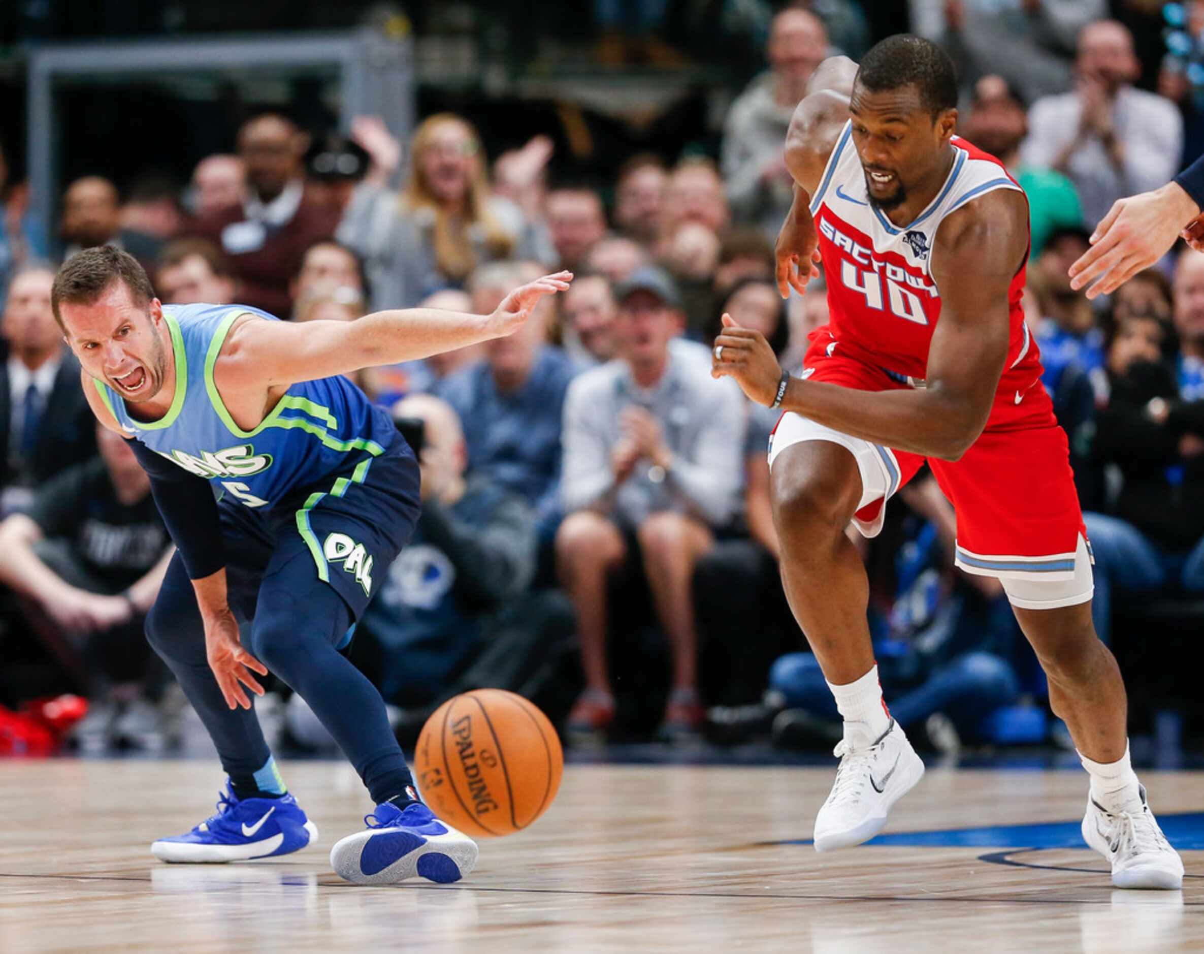 Sacramento Kings forward Harrison Barnes (40) and Dallas Mavericks guard J.J. Barea (5)...