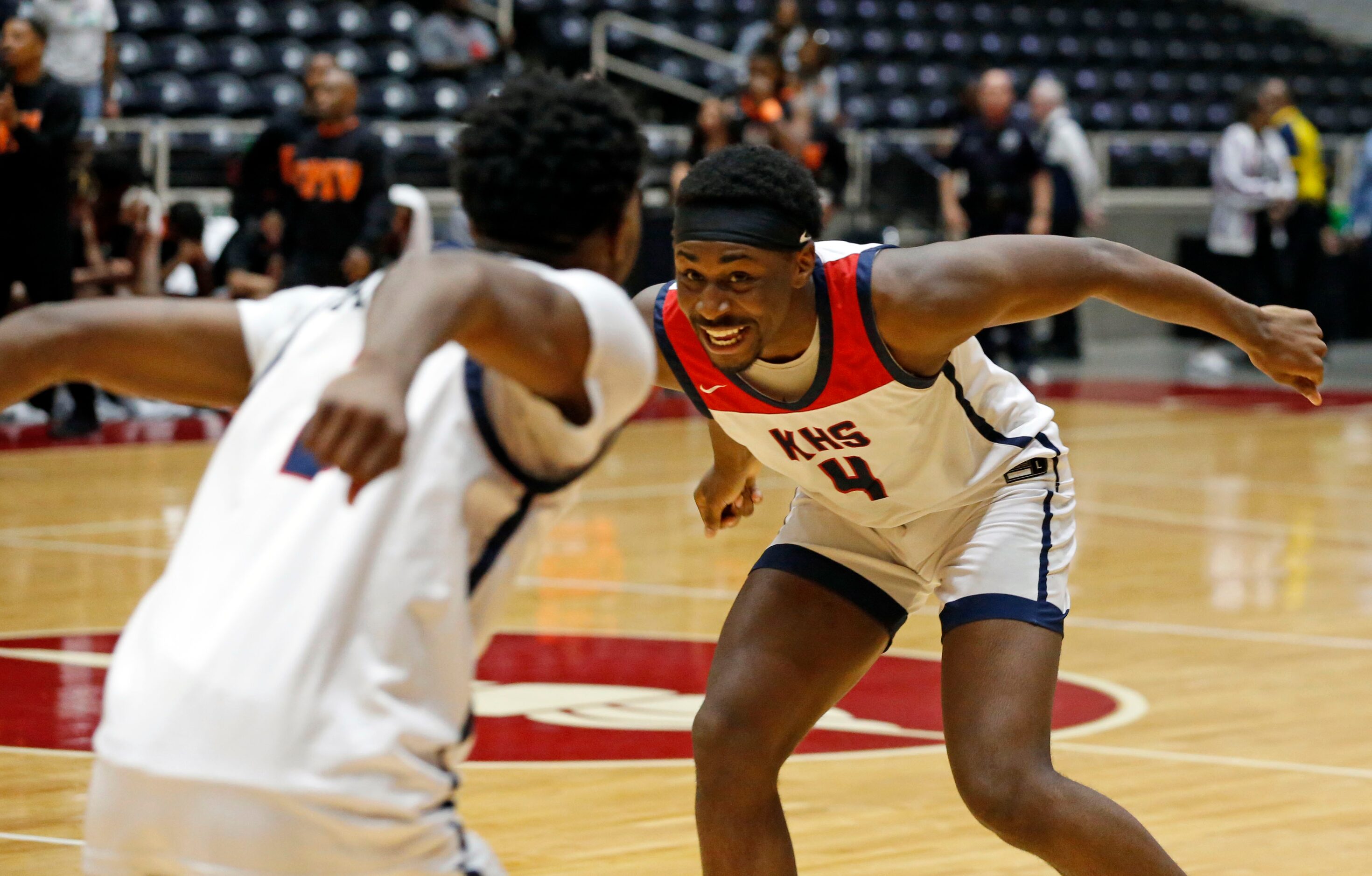 Kimball High’s T’Johnn Brown (2) and Kimball High’s DaCannon Wickware (4) celebrate at the...