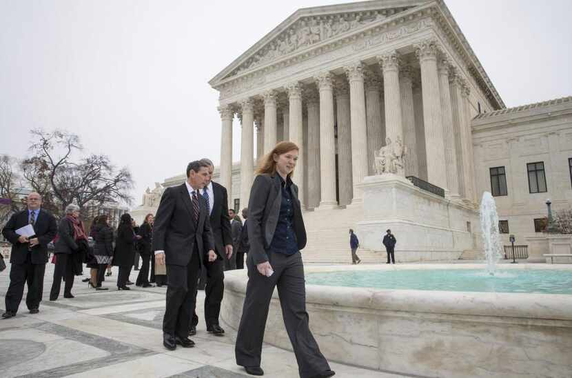 
Abigail Fisher, who challenged the use of race in college admissions, walks with lawyers...